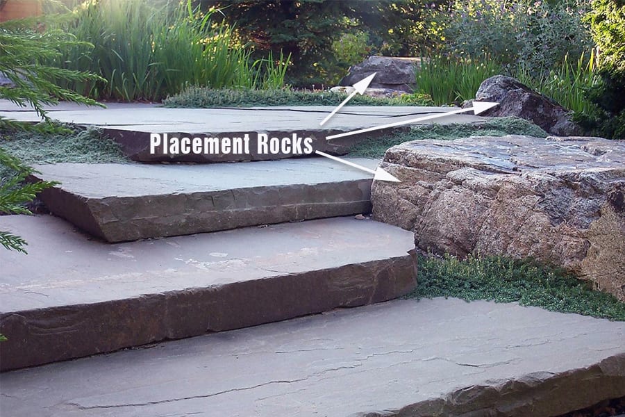 Example of sculptural placement rocks used alongside a walkway.