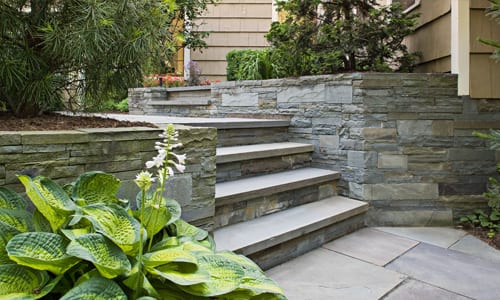 A picture of a bluestone wall