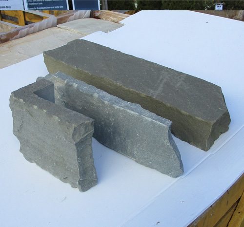 a picture showing thin veneer stone verses full size veneer stone