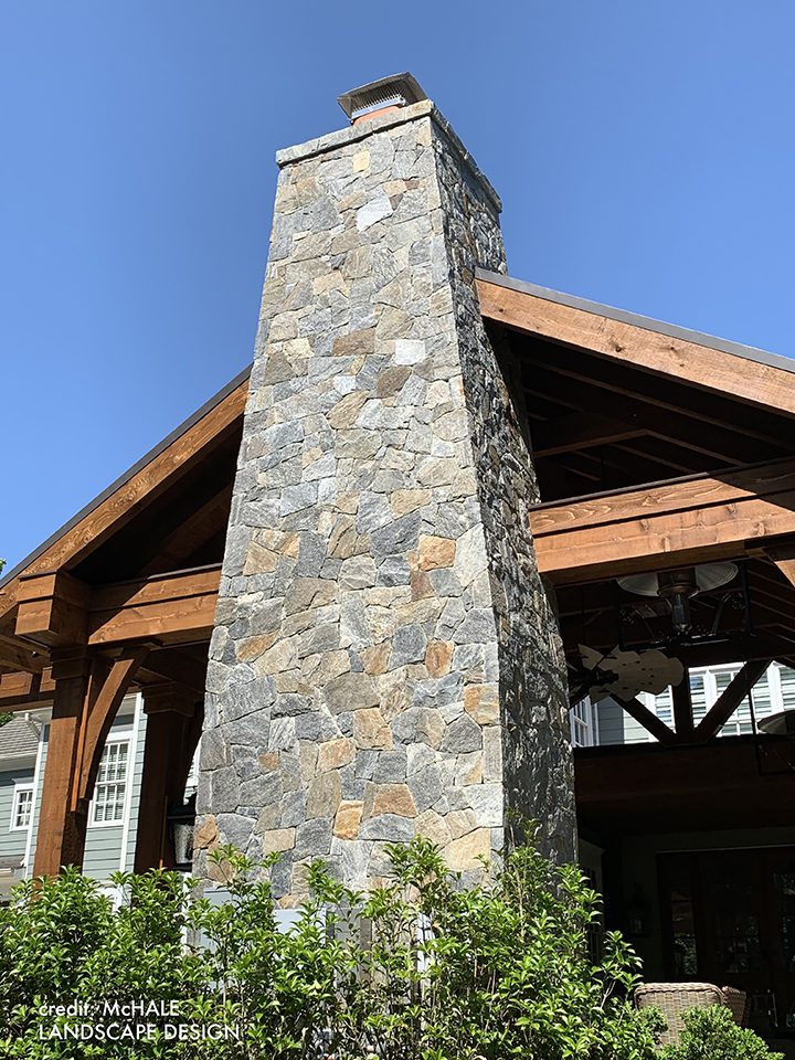 Picture of an outdoor fireplace covered in thin veneer stone from Natural Facing