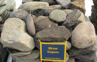 A picture of roundish river copers garden path stepping stones