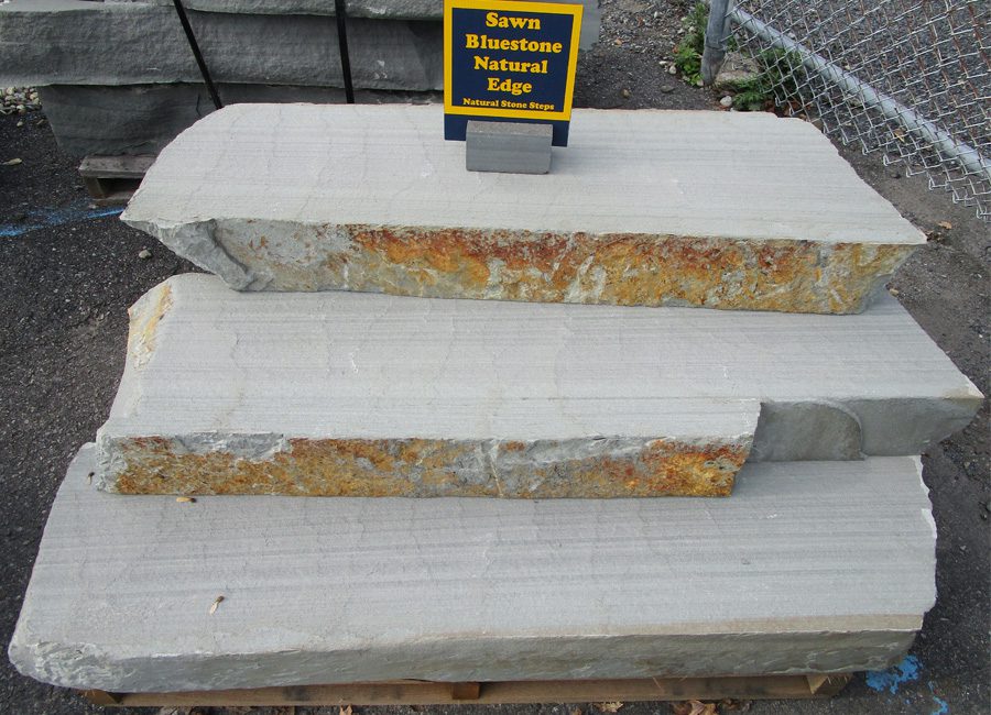 A picture of sawn bluestone natural stone steps with a natural edge