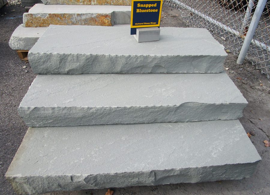 Snapped bluestone steps for a natural edge look