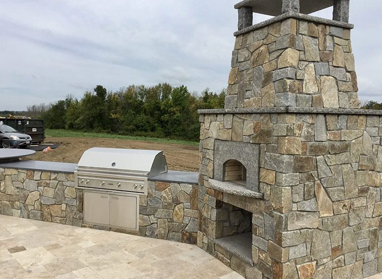 Thin-Veneer-Stone-On-An-Outdoor-Fireplace