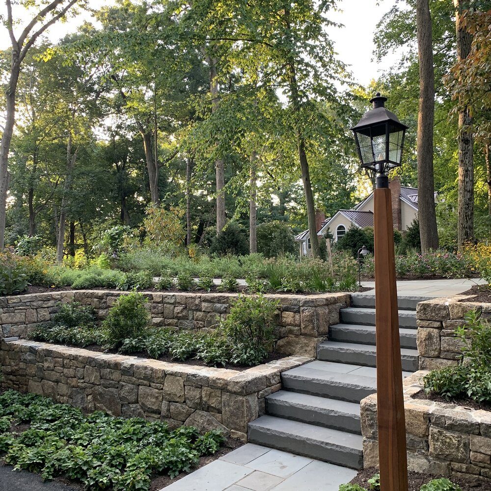 Snapped Indian Hill gallstone and dimensional bluestone steps. Photo Courtesy of btslandscaping.com, Masonry work by Viola Construction