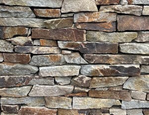 A picture of our colorful Carmel Hill veneer stone in a ledge stone cut