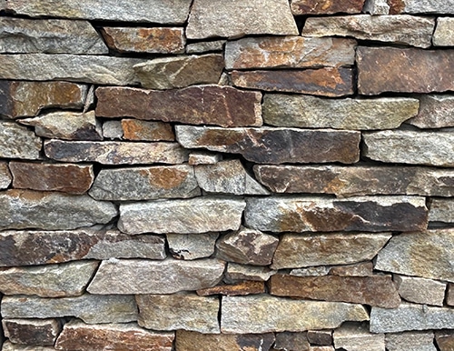 A picture of our colorful Carmel Hill veneer stone in a ledge stone cut