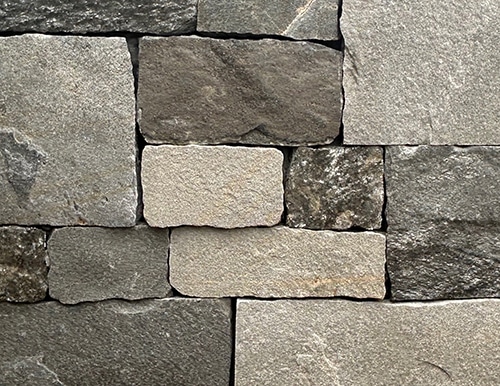 Sierra Ridge is a mix of darker and lighter colored thin veneer stone for fireplaces, kitchens and more